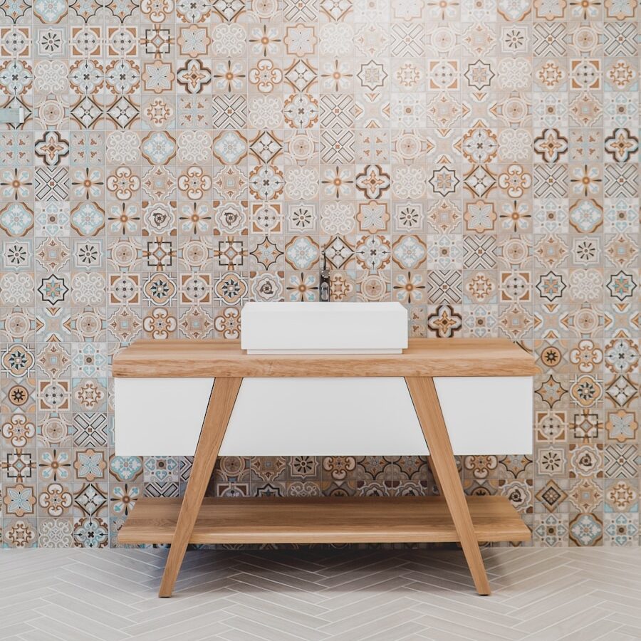 brown wooden table beside white and black wall